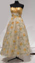Off-white strapless floor length evening gown with yellow-gold bust and overall yellow, gold an…