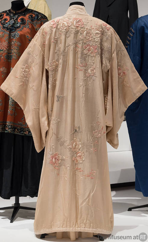 Rear view of pale pink kimono with pink and grey embroidered floral design 