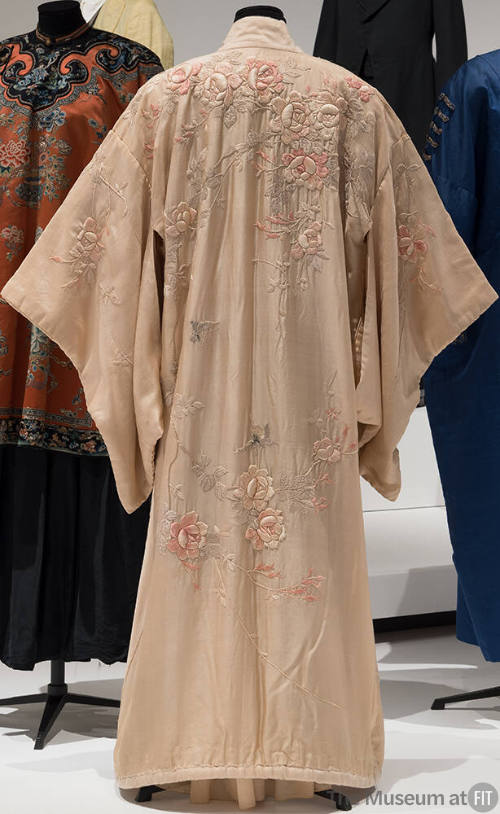 Rear view of pale pink kimono with pink and grey embroidered floral design 