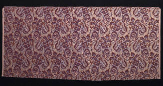 Rectangular velvet textile of red/brown flower leaf and scroll motif on yellow, blue and grey b…