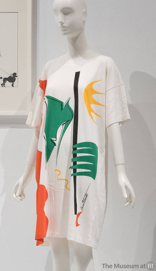 White oversize short sleeve t-shirt with abstract print in green, yellow, orange and black