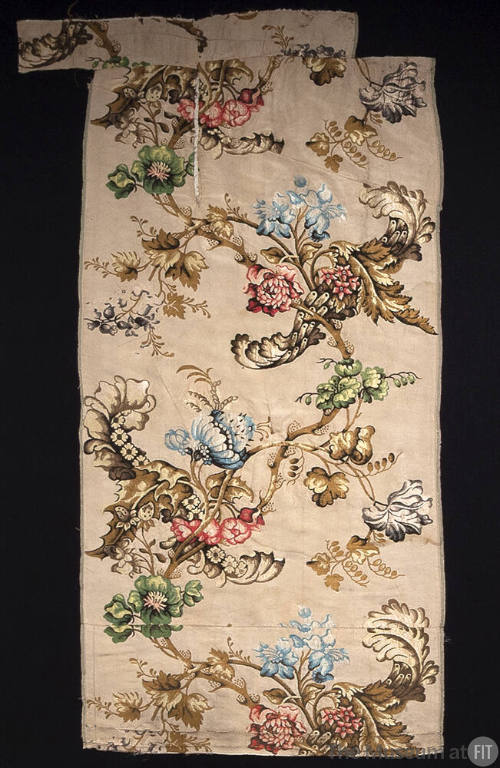Rectangular brocade textile with floral and branch motifs in brown, green, yellow, blue, red, p…