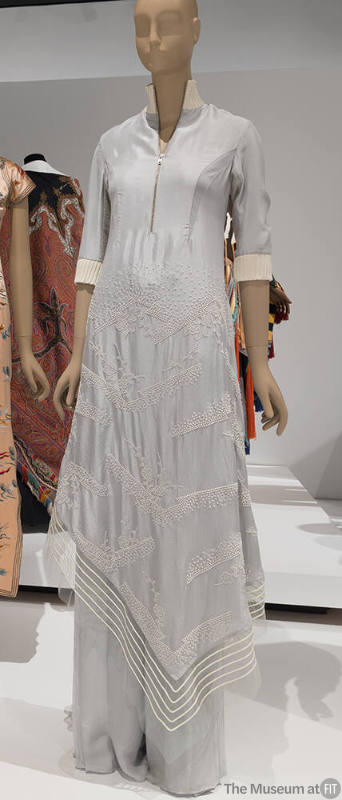 Grey set of zip front tunic with elbow length sleeves and off-white embroidered cherry blossom …