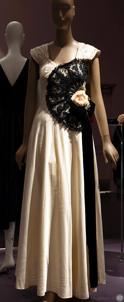 Off-white floor length sleeveless dress with large black beaded fan applique with center off-wh…