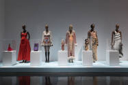 Doll Dressing exhibition installation view of five dressed mannequins with corresponding dolls …