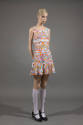 Orange, pink, blue and white floral sleeveless mini dress with white knee highs and black Mary …