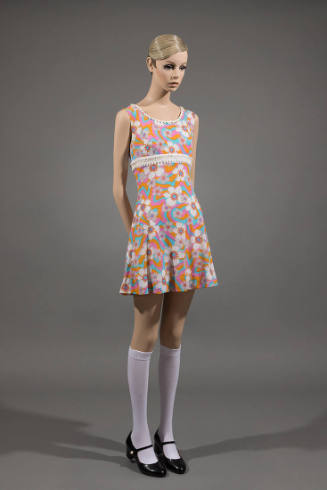 Orange, pink, blue and white floral sleeveless mini dress with white knee highs and black Mary …