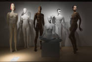Doll Dressing exhibition installation view of six undressed mannequins in various sizes, positi…
