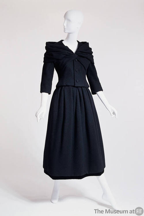 Black calf length dress and jacket with draped collar