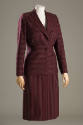 Purple and brown striped suit with horizontal and vertical stripe panels and calf length skirt