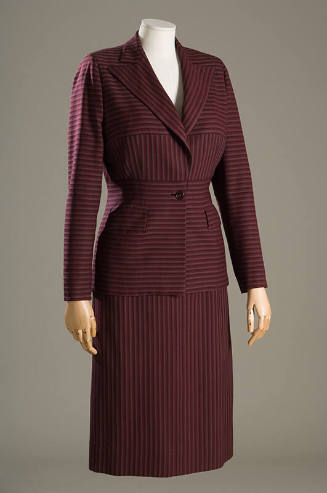 Purple and brown striped suit with horizontal and vertical stripe panels and calf length skirt