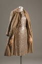 Evening set of gold sequined sleeveless sheath dress and matching camel coat with same sequined…