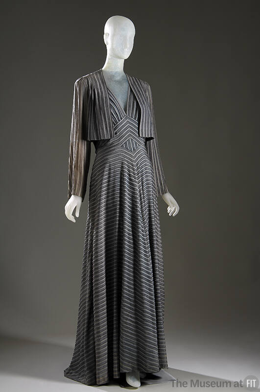 Floor length grey striped evening dress with V-neck, diamond shaped insert at middle and matchi…