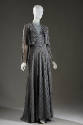 Floor length grey striped evening dress with V-neck, diamond shaped insert at middle and matchi…