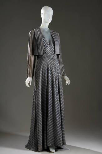 Floor length grey striped evening dress with V-neck, diamond shaped insert at middle and matchi…