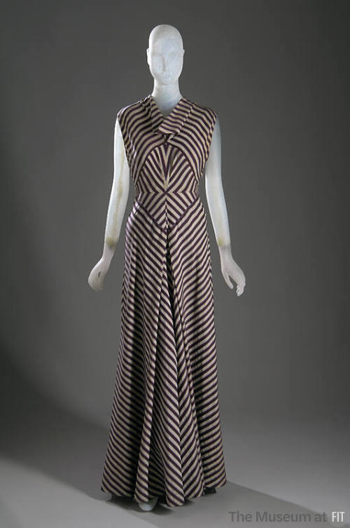 Floor length white, violet and lavender striped evening dress with cap sleeves, diamond shaped …