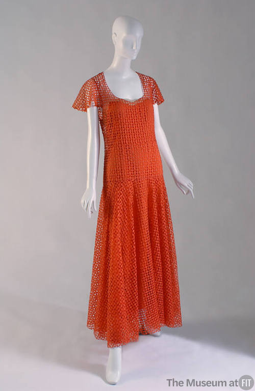 Orange floor length openwork evening dress made of small diamond cut pieces with cap sleeves