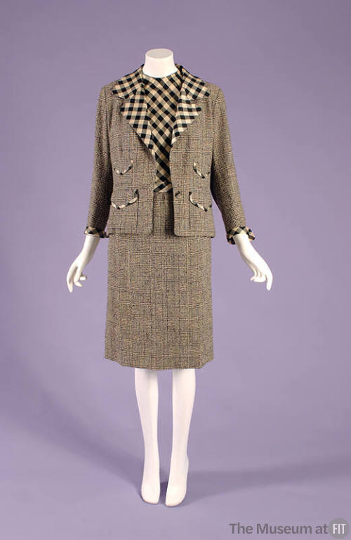 Suit of small black and white checks with larger check lapels and shell top with knee length st…