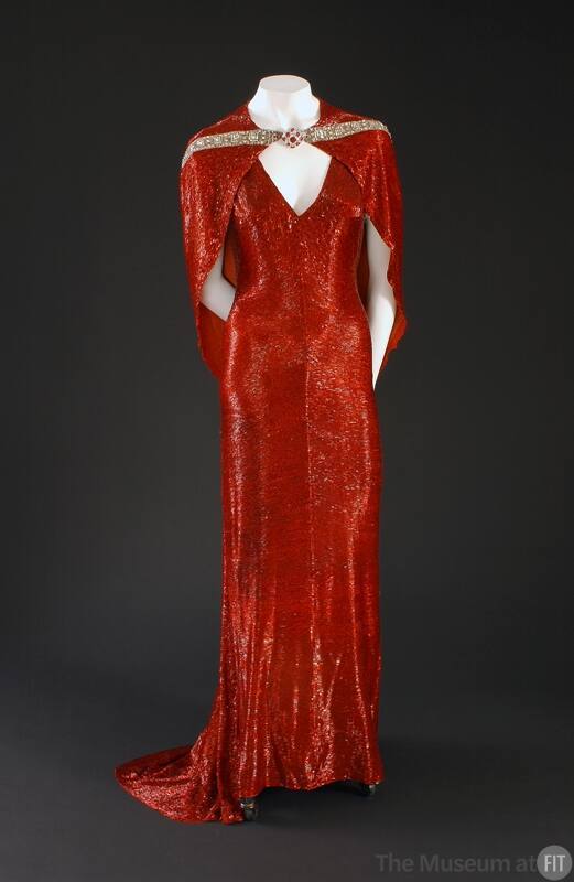 Red beaded floor length V-neck evening dress with short train and matching capelet with rhinest…