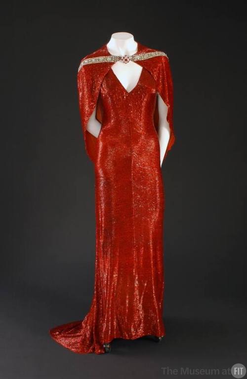 Red beaded floor length V-neck evening dress with short train and matching capelet with rhinest…