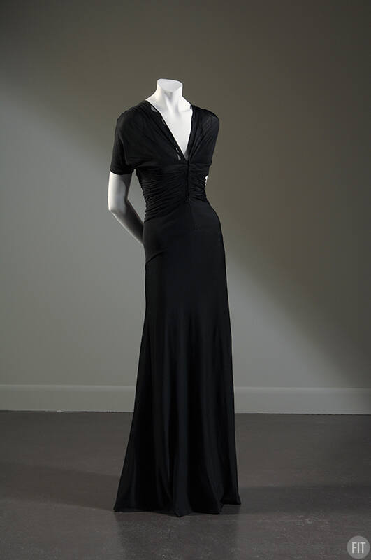 Sheer black floor-length evening dress with v-neck and pleating across midriff
