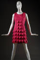 Fuchsia pink sleeveless mini dress with small molded diamond pattern around neck and arm holes …