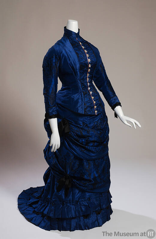 Royal blue two-piece dress with fitted bodice and 3/4 sleeves and mother of pearl buttons down …