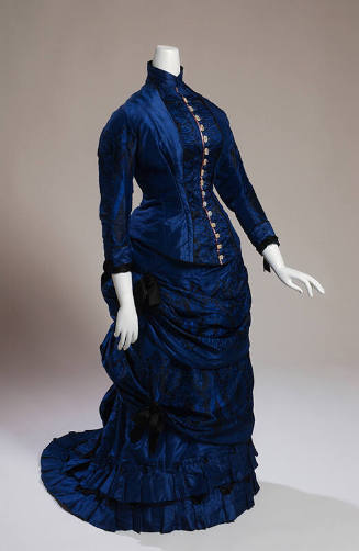 Royal blue two-piece dress with fitted bodice and 3/4 sleeves and mother of pearl buttons down …