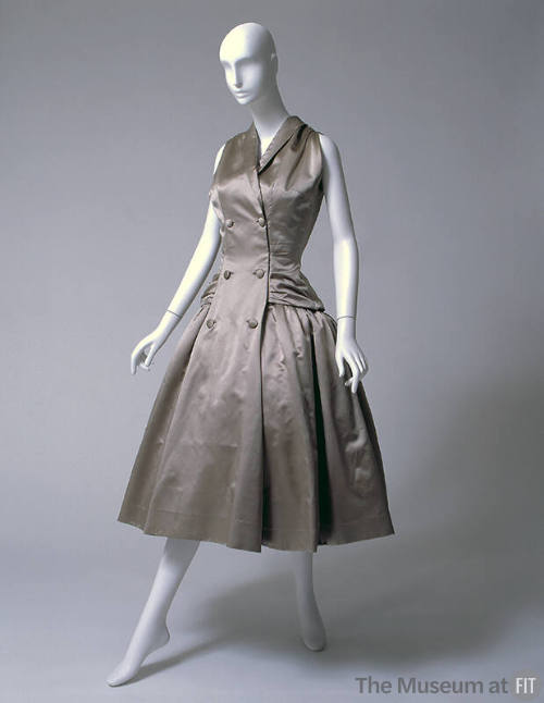 Beige sleeveless, knee-length evening dress with double breasted coatress styling