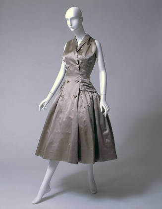 Beige sleeveless, knee-length evening dress with double breasted coatress styling
