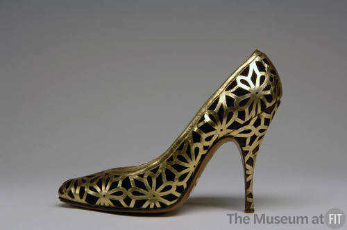 Purple high heeled pump overlayed with gold floral latticework