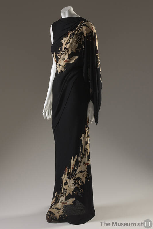 Full length black sleeveless evening dress with beige lily print spiralin from hem to left shou…