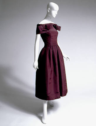 Dark purple strapless cocktail dress with bell skirt and matching narrow shoulder stole with tw…