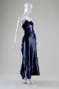Navy blue floor-length evening dress with spaghetti straps, ruffled bodice, and boned corselet …