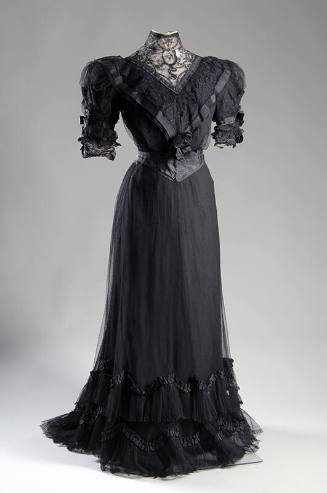 Short sleeve black dinner dress lace bodice with puff sleeves and matching skirt with small tra…