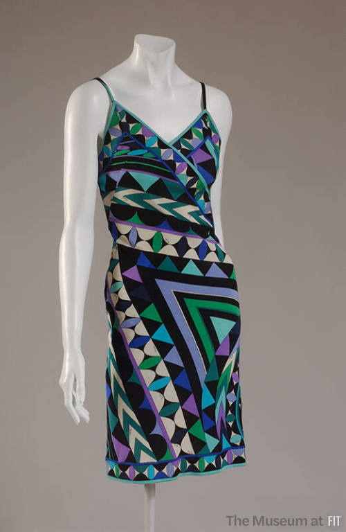 Sleeveless dress in black, white, green, and blue stripe and triangle print