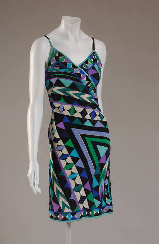 Sleeveless dress in black, white, green, and blue stripe and triangle print