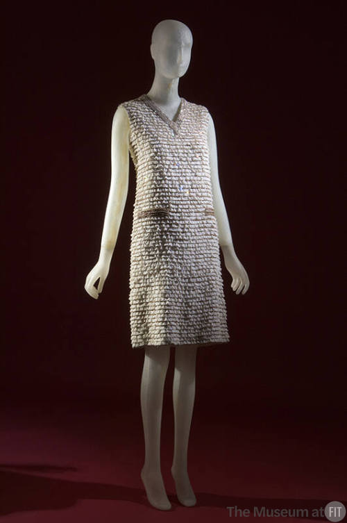Silver sleeveless above-the-knee evening dress with horizontal bands of white lace and beading,…