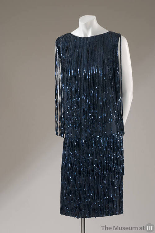 Sleeveless blue knee-length dress; blue sequins fringe strips 