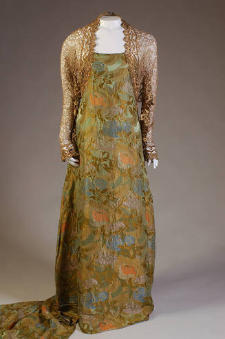 Floor-length green and gold floral brocade dress with gold lace bolero