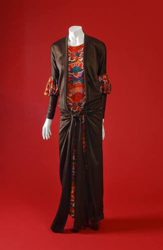 Brown satin open-front, floor length overdress, red/multicolor print sheath dress visible under