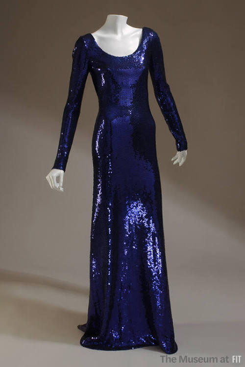 Floor-length dark blue sequined dress with scoop neck and long sleeves