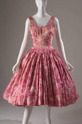 Pink and white rose print sleeveless cocktail dress with sweetheart neckline, fitted bodice and…