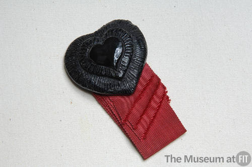 Black pin of thee concentric hearts with red grosgrain ribbon trim in four lengths 