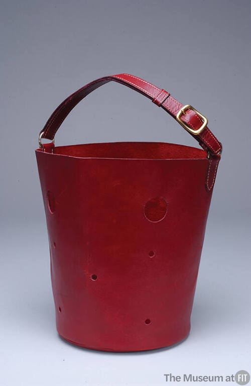 Red leather bucket shaped handbag with cut-out circles