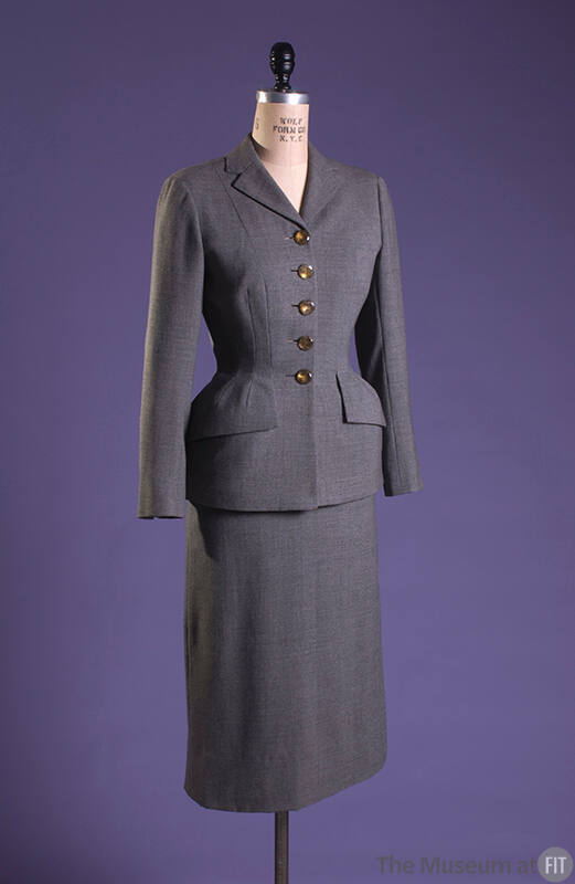 Grey suit padded under front hips and under pocket flaps with calf length skirt