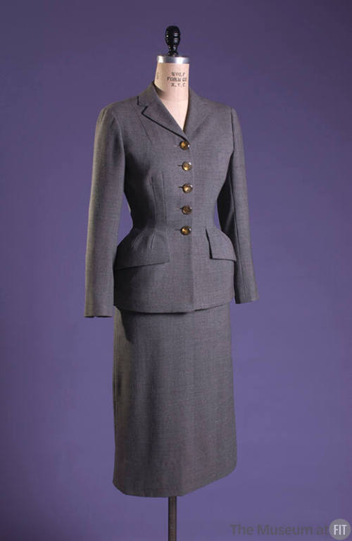 Grey suit padded under front hips and under pocket flaps with calf length skirt
