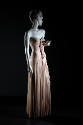 Pale pink floor length strapless evening dress with ruffle effect on center front bodice