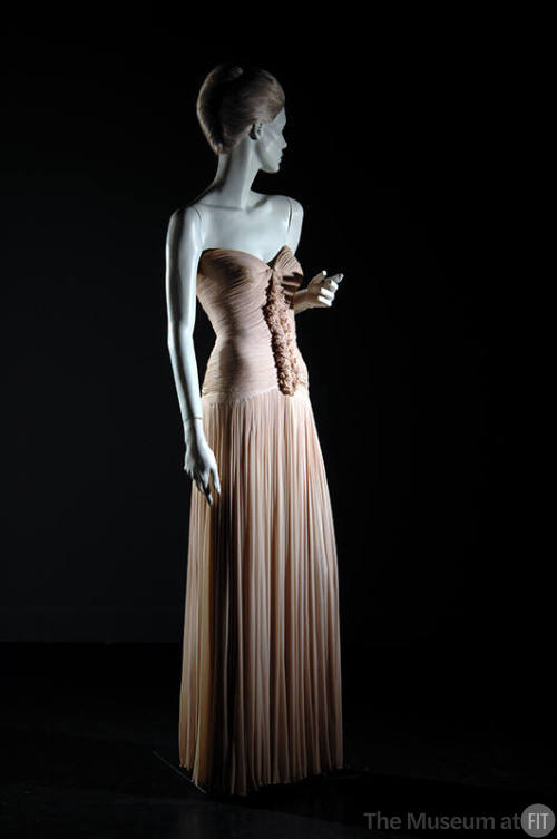 Pale pink floor length strapless evening dress with ruffle effect on center front bodice