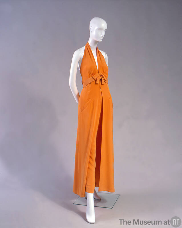 Orange wide leg pants with halter top and belt with self tie bow 
